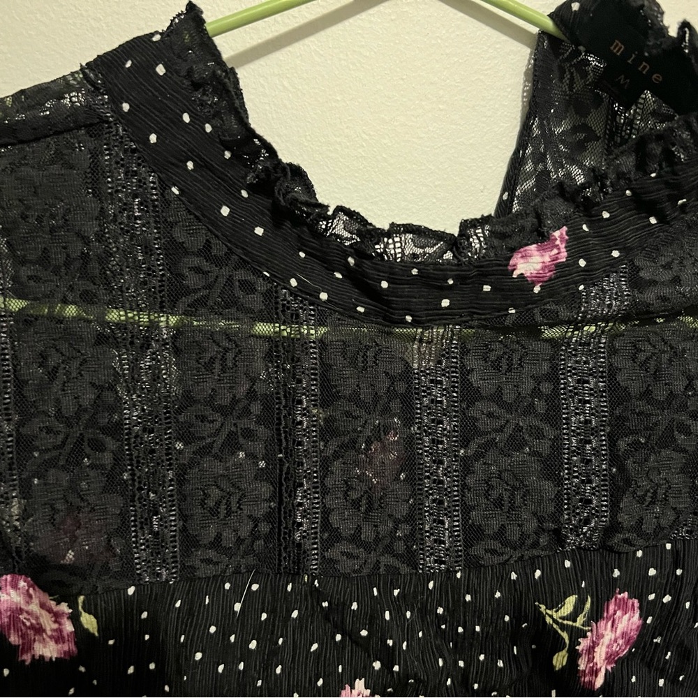 Three quarter sleeve black lace and floral blouse.